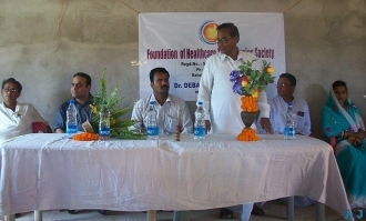 Discussion with local village leaders about Health ATM in rural Orissa, India 2010